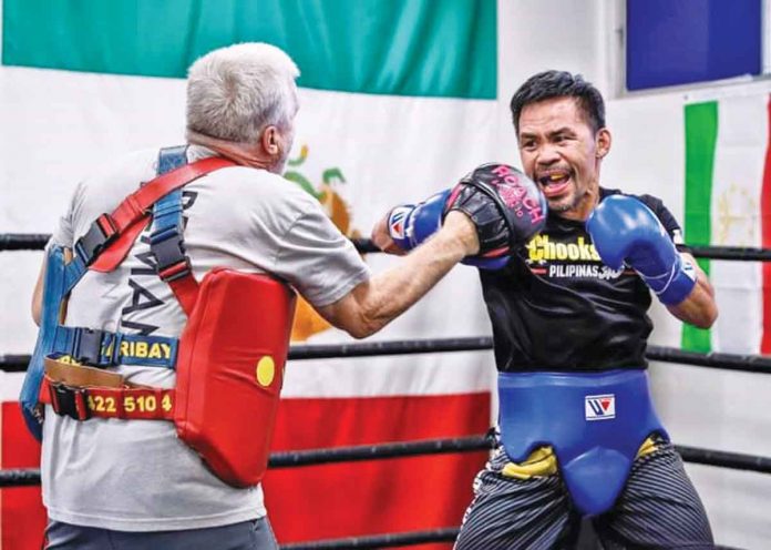 Manny Pacquiao trains with Coach Freddie Roach at the Wild Card Gym in Los Angeles, California, for his upcoming bout against Yordenis Ugas on August 21. CHOOKS TO GO