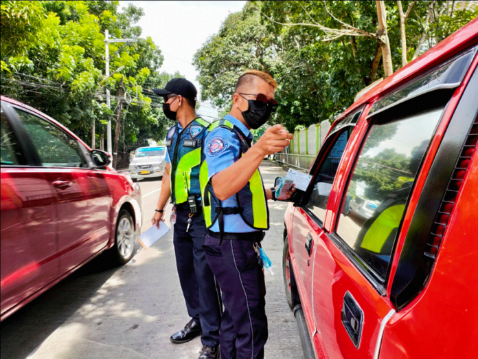 Photo shows LTO-6 personnel inspecting a vehicle in front of Arevalo Elementary School in Arevalo, Iloilo City. PANAY NEWS PHOTO