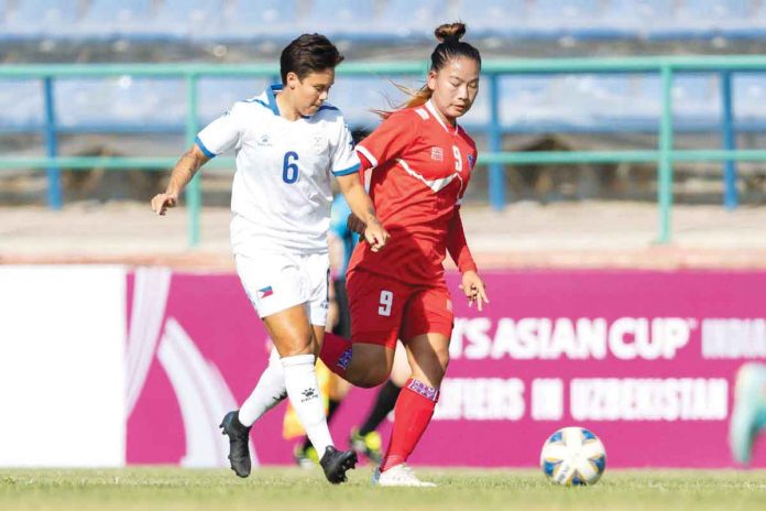 Philippine Malditas’ Tahnai Annis (6) battles with Nepal’s Sabita Rana Magar (9) for the loose ball during the 2022 AFC Women’s Asian Cup qualifiers in Uzbekistan. AFC