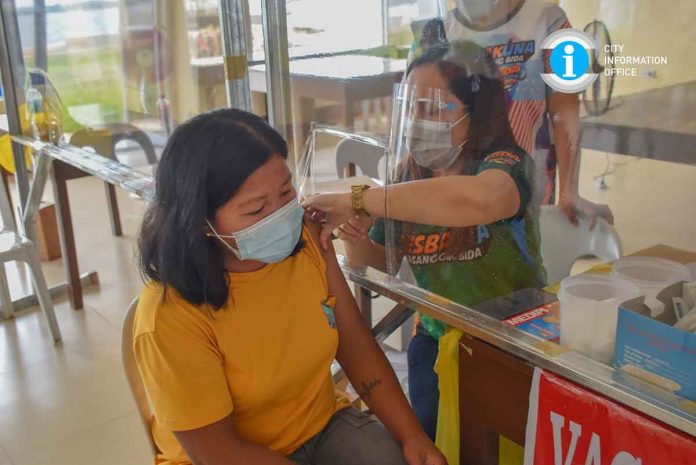 A resident avails herself of a coronavirus disease 2019 vaccine in San Carlos City, Negros Occidental. SAN CARLOS CITY LGU