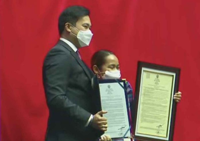 Weightlifter Hidilyn Diaz was conferred the Congressional Medal of Excellence following her historic gold medal win in the 2020 Tokyo Olympics. VIA INQUIRER