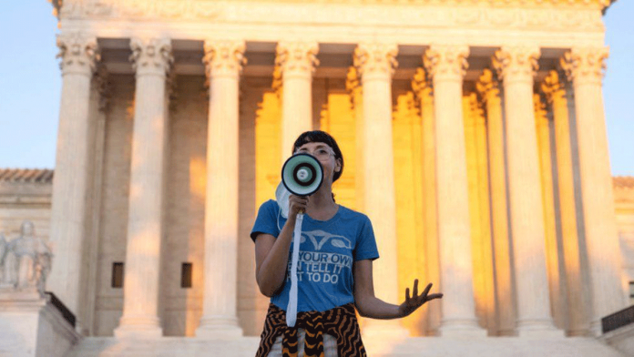 An activist protests against the new Texas abortion law outside the Supreme Court in Washington DC. GETTY IMAGES