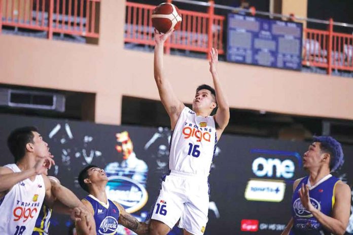 Roger Pogoy of TNT Tropang GIGA goes for a one-handed basket during Sunday night's 2021 PBA Philippine Cup game against Magnolia Pambansang Manok Hotshots. PBA