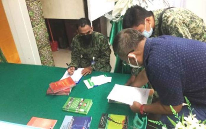 The Aklan Police Provincial Office checks the books deemed “subversive” that were turned over to it by the Aklan State University. BANGA POLICE STATION PHOTO