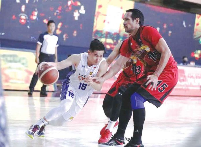 Bacolodnon guard Kib Montalbo of TNT Tropang Giga tries to ward off the defense of San Miguel Beermen center June Mar Fajardo in Game 1 of their 2021 PBA Philippine Cup semifinals on Sunday night. PBA MEDIA BUREAU