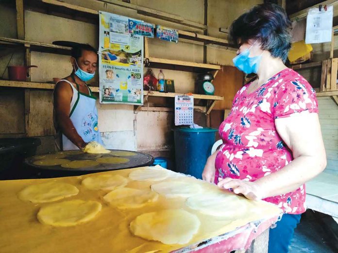 This couple has been making lumpia wrappers at the public market in La Paz, Iloilo City for over 30 years now. This business helps them make ends meet. PANAY NEWS PHOTO