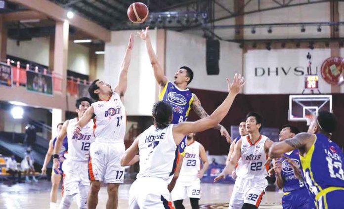 Magnolia Pambansang Manok Hotshots’ Jiovani Jalalon scores on a floater while being surrounded by Meralco Bolts defenders in Game 2 of the 2021 PBA Philippine Cup quarterfinals. PBA MEDIA BUREAU