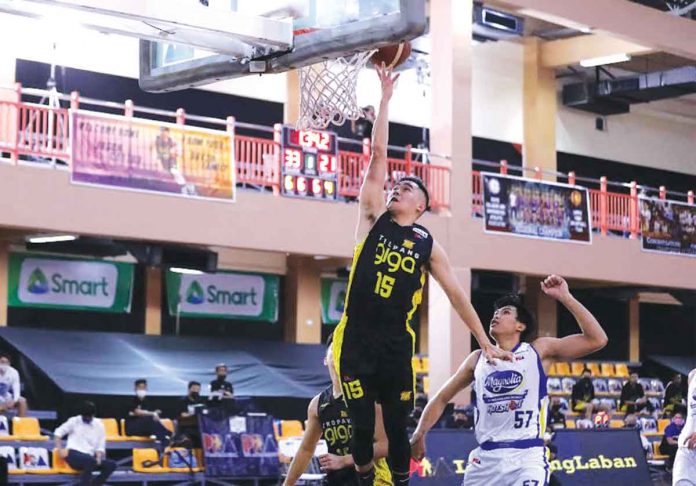 Bacolodnon Kib Montalbo of TNT Tropang Giga stretches for a layup in Game 2 of their 2021 PBA Philippine Cup finals match against the Magnolia Pambansang Manok Hotshots. PBA MEDIA BUREAU