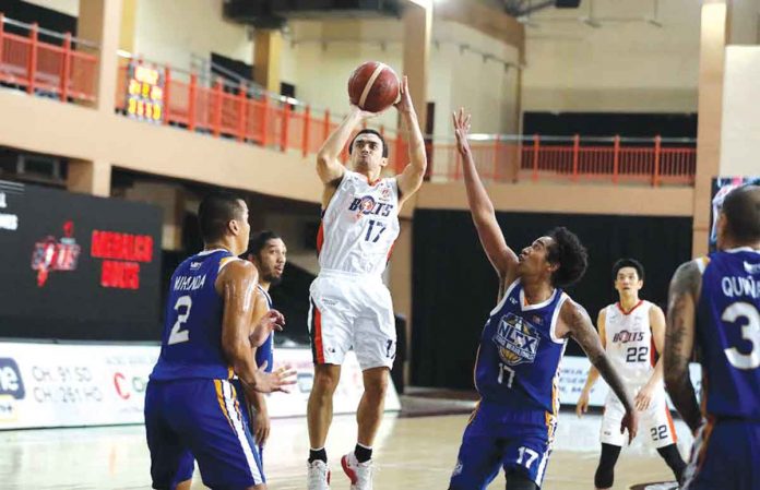 Ilonggo Antonio Jose Caram of Meralco Bolts pulls up for a basket against NLEX Road Warriors. PBA MEDIA BUREAU