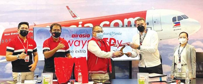 From left to right: AirAsia Philippines Communications and Public Affairs Head Steve Dailisan, CFO Ray Berja, CEO Ricky Isla, Operation Smile Philippines Executive Director Emiliano Romano and Development Manager Carolynne Arriola.