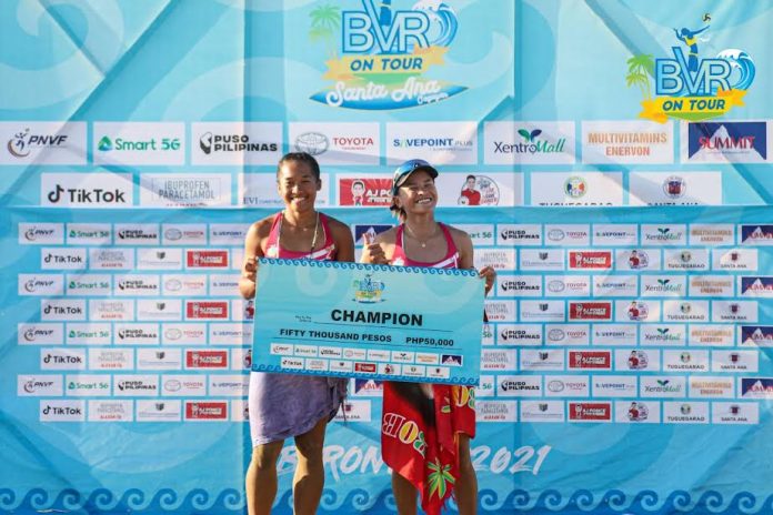 Negrense Bernadeth Pons and Cherry Rondina of Creamline 1 hold a symbolic cheque of their prize for ruling the second leg of the Beach Volleyball Republic on Tour in Santa Ana, Cagayan. BVR PHOTO