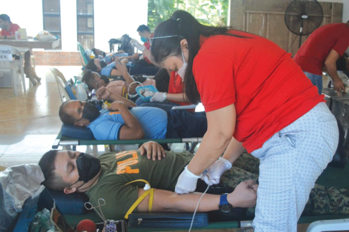 Personnel of the Iloilo Police Provincial Office donate blood at their headquarters in Santa Barbara, Iloilo. PANAY NEWS PHOTO