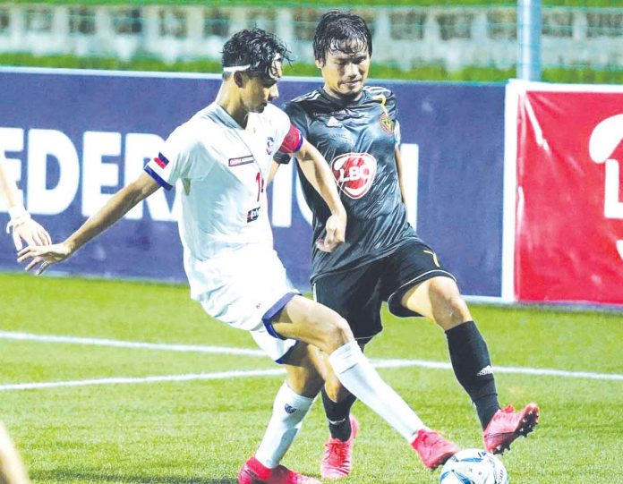 Azkals Development Team’s Jarvey Gayoso and Kaya Futbol Club-Iloilo’s Jovin Bedic battle for the ball during their 2021 Copa Paulino Alcantara group stage encounter. PFL PHOTO