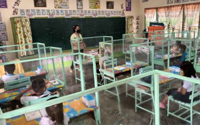 Plastic barriers are installed in between seats of learners of the Laserna Integrated School in Nabas, Aklan to ensure safe physical distancing. A total of 224 learners from Kindergarten to Grade III are joining limited face-to-face classes that started on Nov. 15, 2021. CONTRIBUTED PHOTO, PNA