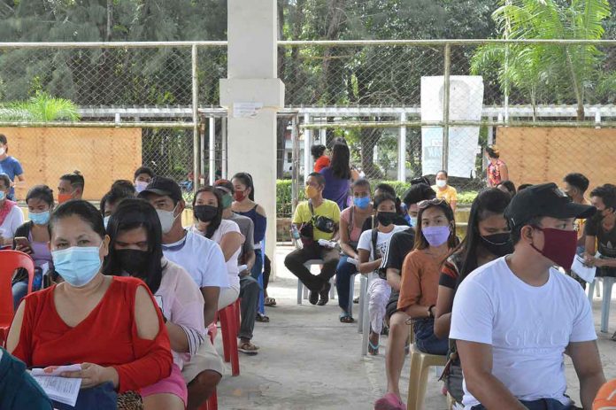 The Department of Health hopes to inoculate more Western Visayans in the three-day national vaccination drive against coronavirus disease 2019. Photo shows people waiting their turn for vaccination in Leganes, Iloilo. PANAY NEWS