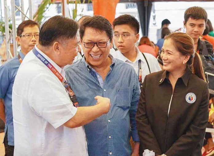 Mayor Jerry Treñas, Labor secretary Silvestre “Bebot” Bello II and Cong. Julienne “Jam-jam” Baronda share a light moment during the turnover of Negokarts and other livelihood projects to Ilonggo beneficiaries earlier this year.