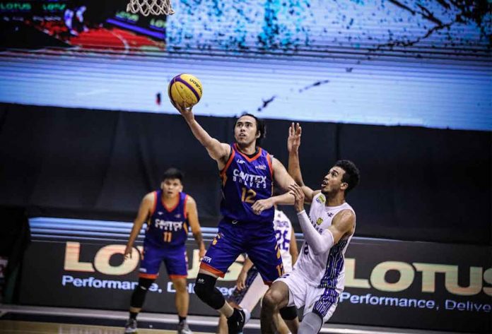 CAVITEX Braves’ Larry Fonacier evades the defense of TNT Tropang Giga’s Jeremiah Gray for his game-winning layup. PBA MEDIA BUREAU