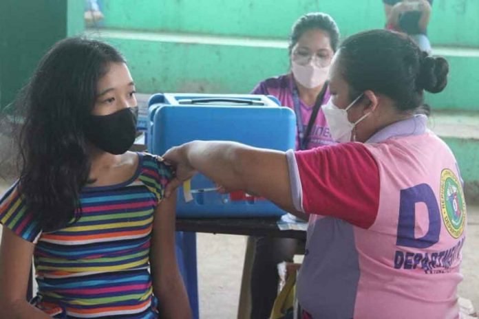 An eligible young resident of Patnongon, Antique is being vaccinated against coronavirus disease during the first round of “Bayanihan Bakunahan” from Nov. 29 to Dec. 1. 2021. PHOTOS FROM PATNONGON LGU