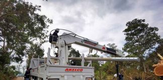 A heavy equipment of Aklan Electric Cooperative is in Guimaras Island helping clear electric posts of typhoon debris. PHOTO BY GUIMELCO