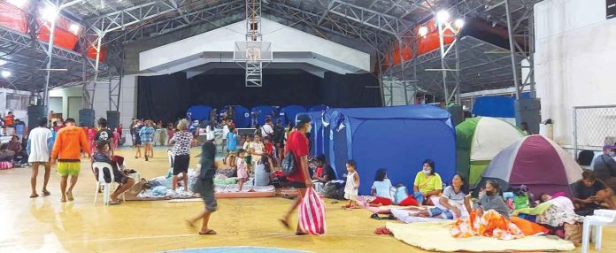 In the municipality of Balete, Aklan residents in high-risk areas sought shelter at the town’s covered gym when super typhoon “Odette” struck. PHOTO BY PATRICK LACHICA