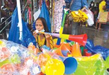 Amid the threat of the Omicron variant of the virus causing coronavirus disease 2019 (COVID-9), the Department of Health discourages the use of torotot in welcoming the new year. Horns, trumpets or whistles can spread the virus through saliva and aerosols discharged into the air. This vendor in Iloilo City, however, remains hopeful people will buy toy trumpets.