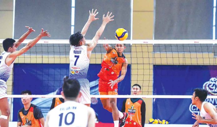 Basilan Steel Spikers Amin Anak Mindanao Party-list’s Razzel Palasoc attacks the defense of MRT-Negros’ Leo Ordiales. PNVF PHOTO