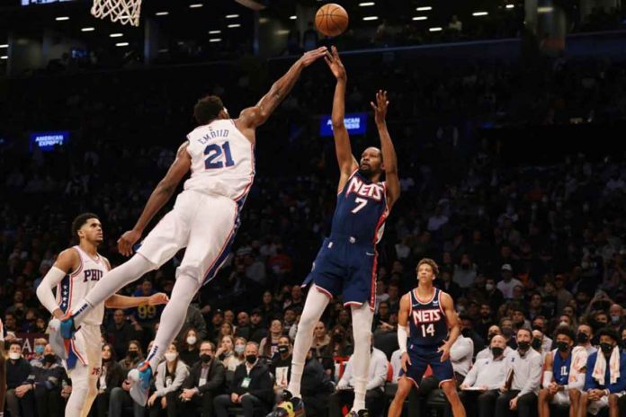 Brooklyn Nets forward Kevin Durant (7) shoots the ball as Philadelphia 76ers center Joel Embiid (21) defends at the Barclays Center. PHOTO BY VINCENT CARCHIETTA, USA TODAY SPORTS