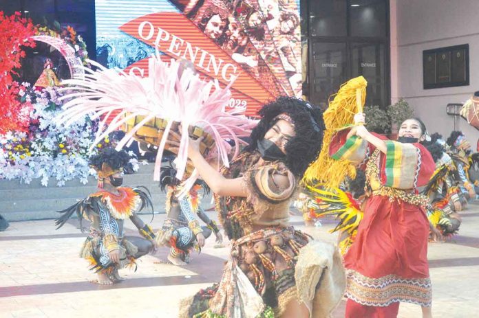 SHOW MUST GO ON. Dinagyang tribe dancers perform during the opening salvo of the annual festival in front of the Iloilo City Hall on Jan. 14, 2021. The pared-down opening of the world-famous festivity pushed through despite the city recording that day 183 fresh coronavirus infections. PN PHOTO