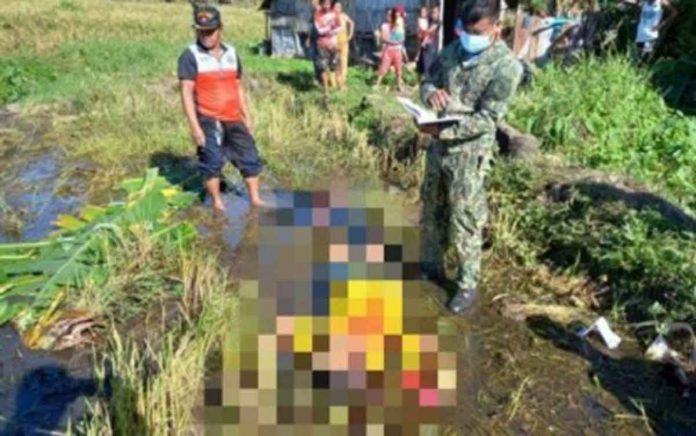 A police investigator documents the shooting of Mario Landisa, a resident of Sitio Mantuhod, Barangay Cabacungan, La Castellana, Negros Occidental on Dec. 20, 2021. The victim died. He was shot by four men who introduced themselves as rebels, after refusing to give food and cash as their family was then reeling from the devastation of super typhoon “Odette”. PHOTO BY 303RD INFANTRY BRIGADE, PHILIPPINE ARMY