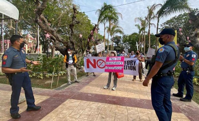 The Alliance Against Mandatory COVID-19 Vaccination in Iloilo City holds a protest at Plaza Libertad. People who remain unvaccinated for whatever reason could be deprived of their sources of income and access to basic necessities because of the restrictions, according to the group. KARAPATAN PANAY PHOTO