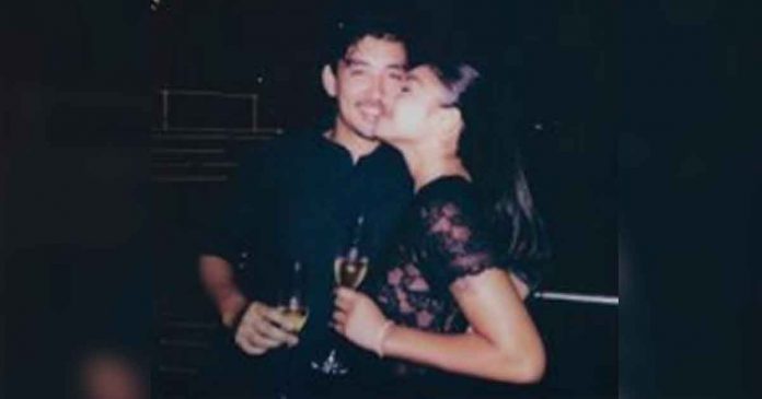 Polaroid snap showing Lustre and Bariou all smiles as they each hold a glass of champagne.