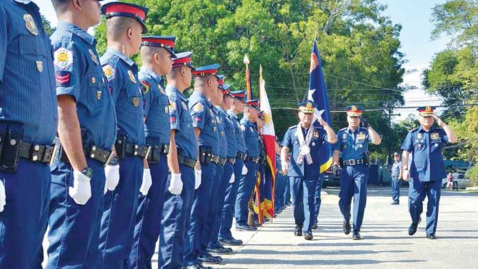 Policemen in Camp Delgado, Iloilo City stand at attention during a testimonial parade and review, in this undated photo. The Police Regional Office 6 is recruiting 200 new police officers for 2022. PN PHOTO