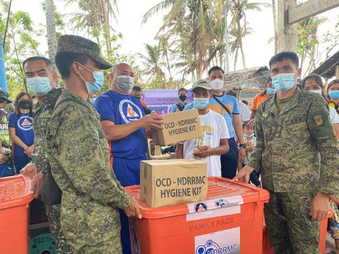 OCD-6 Regional Director Jose Roberto R. Nuñez led the distribution of 100 food packs and 200 hygiene kits. PHOTOS FROM FACEBOOK PAGE OF OCD-6