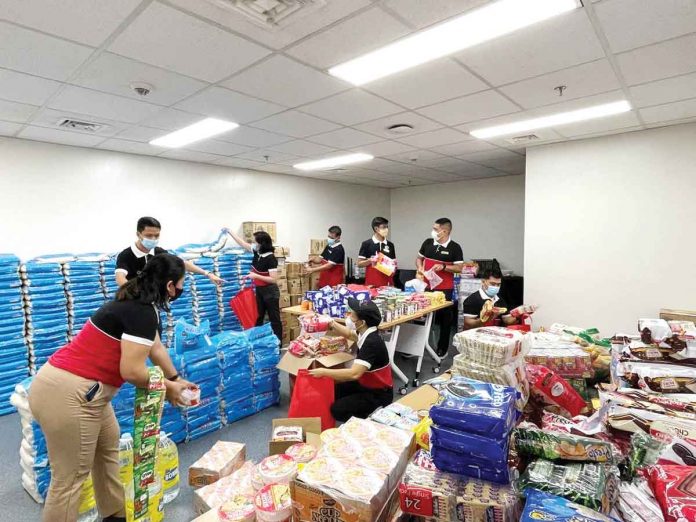 The team of Savoy Hotel Mactan Newtown repacking relief items received from all other properties of Megaworld Hotels and Resorts for distribution to 127 families in Mactan area.