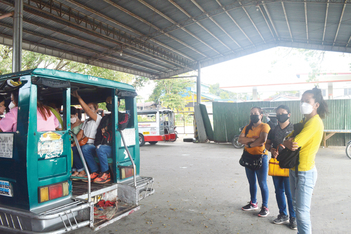 There are no more available seats in this jeepney so these three passengers have to wait for the next available jeepney at the transport terminal in Barangay Ungka, Jaro, Iloilo City. The city government has announced that seven new public transport routes will open soon. PN PHOTO