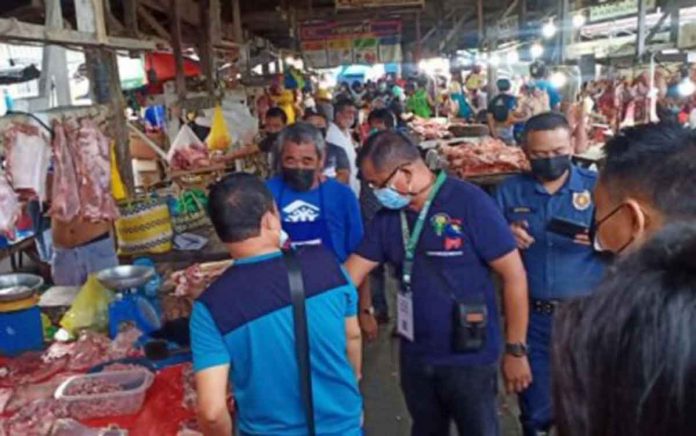 A team from the National Meat Inspection Service conducts a regular inspection at a public market in Iloilo City to discourage backyard slaughtering. PNA photo courtesy of Randy Lontoc/ NMIS FB page