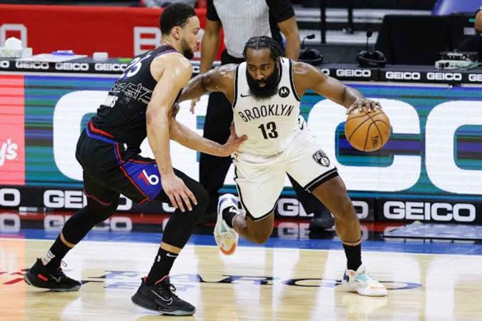 James Harden (13) attacks the defense of Ben Simmons (25) during the Brooklyn Nets-Philadelphia 76ers encounter during the 2020-2021 NBA Season. GETTY IMAGES