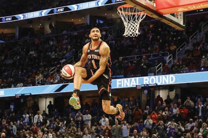 Obi Toppin of the New York Knicks dunks during the AT&T Slam Dunk Competition of the 2022 NBA All-Star on Saturday night at Cleveland, Ohio. GETTY IMAGES