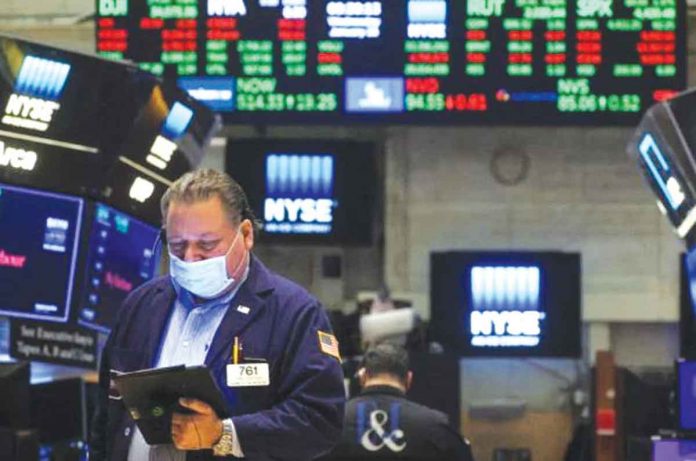 Traders work on the floor of the New York Stock Exchange (NYSE) in New York City,USA