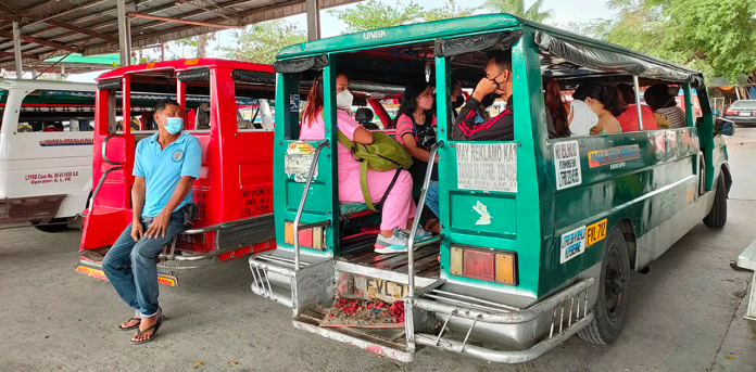 A driver waits for more passengers to board his jeepney at the transport terminal in Barangay Ungka, Jaro, Iloilo City. The more passengers he has, the better, he says. Just this March 8, gas prices further soared by as much as P3.80 per liter of gasoline and by P5.50 per liter of diesel. PN PHOTO