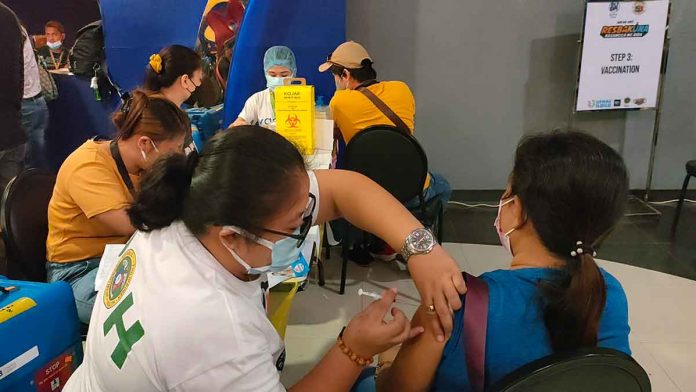 A woman gets her shot of the vaccine against coronavirus disease at a mall in Mandurriao, Iloilo. PN PHOTO