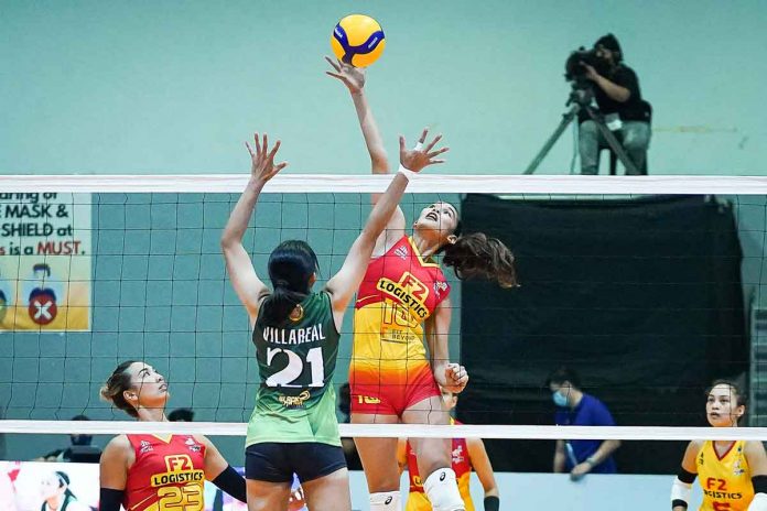 F2 Logistics’ middle blocker Mary Joy Baron flaunts her offensive skills by ripping Army’s single coverage put up by Jeanette Villareal. PVL MEDIA BUREAU