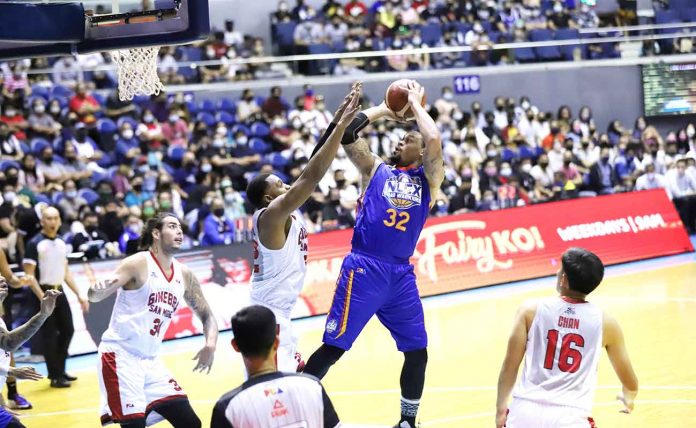 NLEX Road Warriors’ KJ McDaniels shoots over Barangay Ginebra San Miguel Kings’ Justin Brownlee. PBA PHOTO