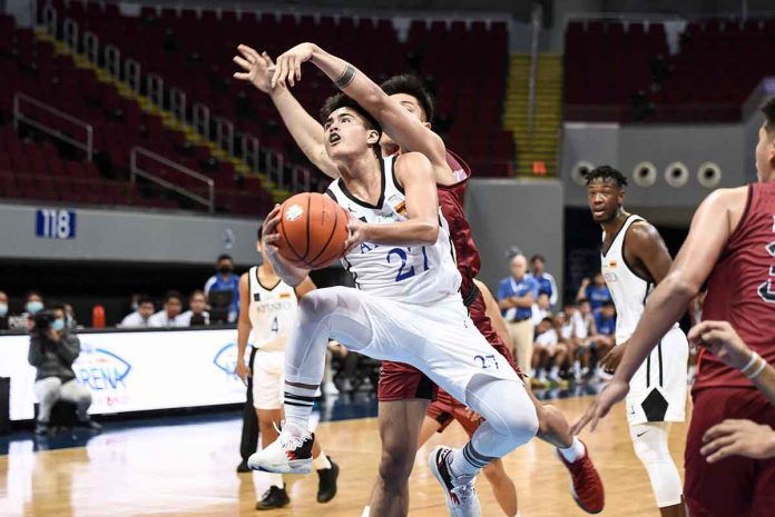 Negrense Samjosef Belangel of Ateneo de Manila University Blue Eagles goes for a tough drive. UAAP PHOTO