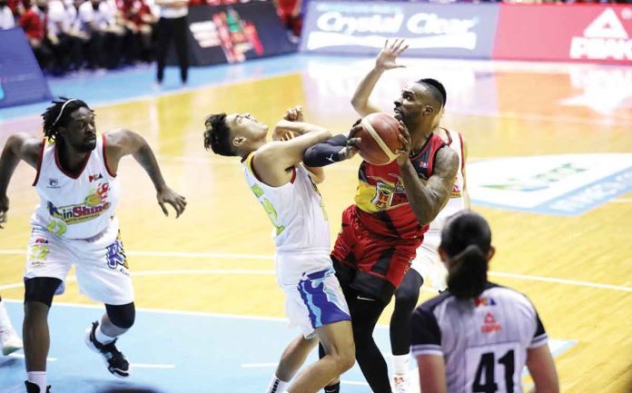 San Miguel Beermen’s Shabazz Muhammad creates separation by warding off the defense of Rain or Shine Elasto Painters’ Vince Tolentino. PBA PHOTO