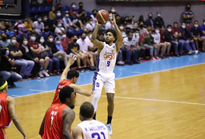 TNT Tropang Giga’s Mikey Williams attempts a three-pointer in front of the defense of NorthPort Batang Pier’s Jerrick Balanza. PBA PHOTO