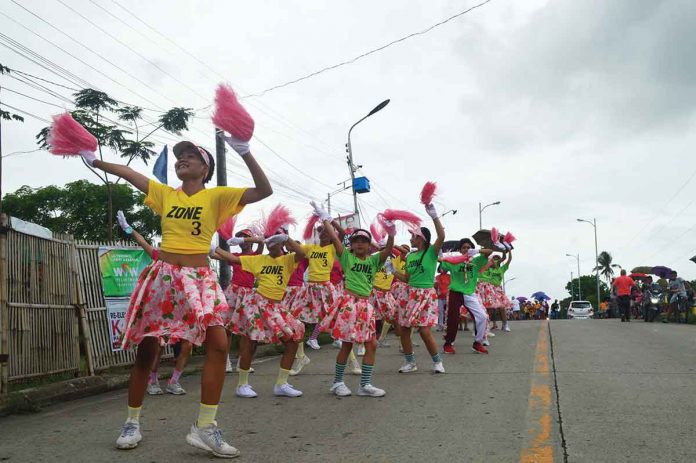 Zone 3 representatives happily dance during the ‘Ice Cream Day’ parade.