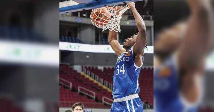 Ateneo de Manila University Blue Eagles center Angelo Kouame with a two-handed dunk. UAAP PHOTO