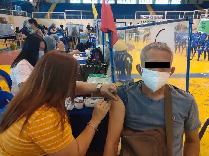 A senior citizen gets vaccinated against coronavirus disease 2019 vaccine in Iloilo City. Although all age groups are at risk of contracting COVID-19, older people face significant risk of developing severe illness if they contract the disease, according to the World Health Organization.PN PHOTO