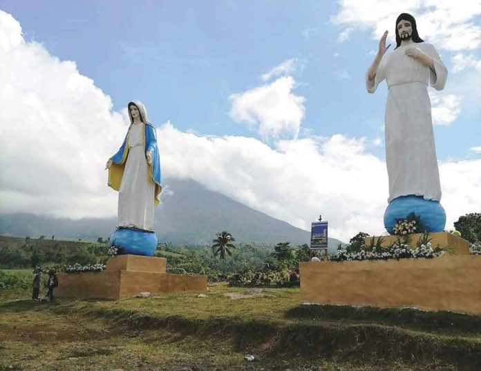 The giant cross and statues of Jess Christ and the Blessed Virgin Mary at Mandayao Panorama Park in Barangay Mansalanao in La Castellana, Negros Occidental.